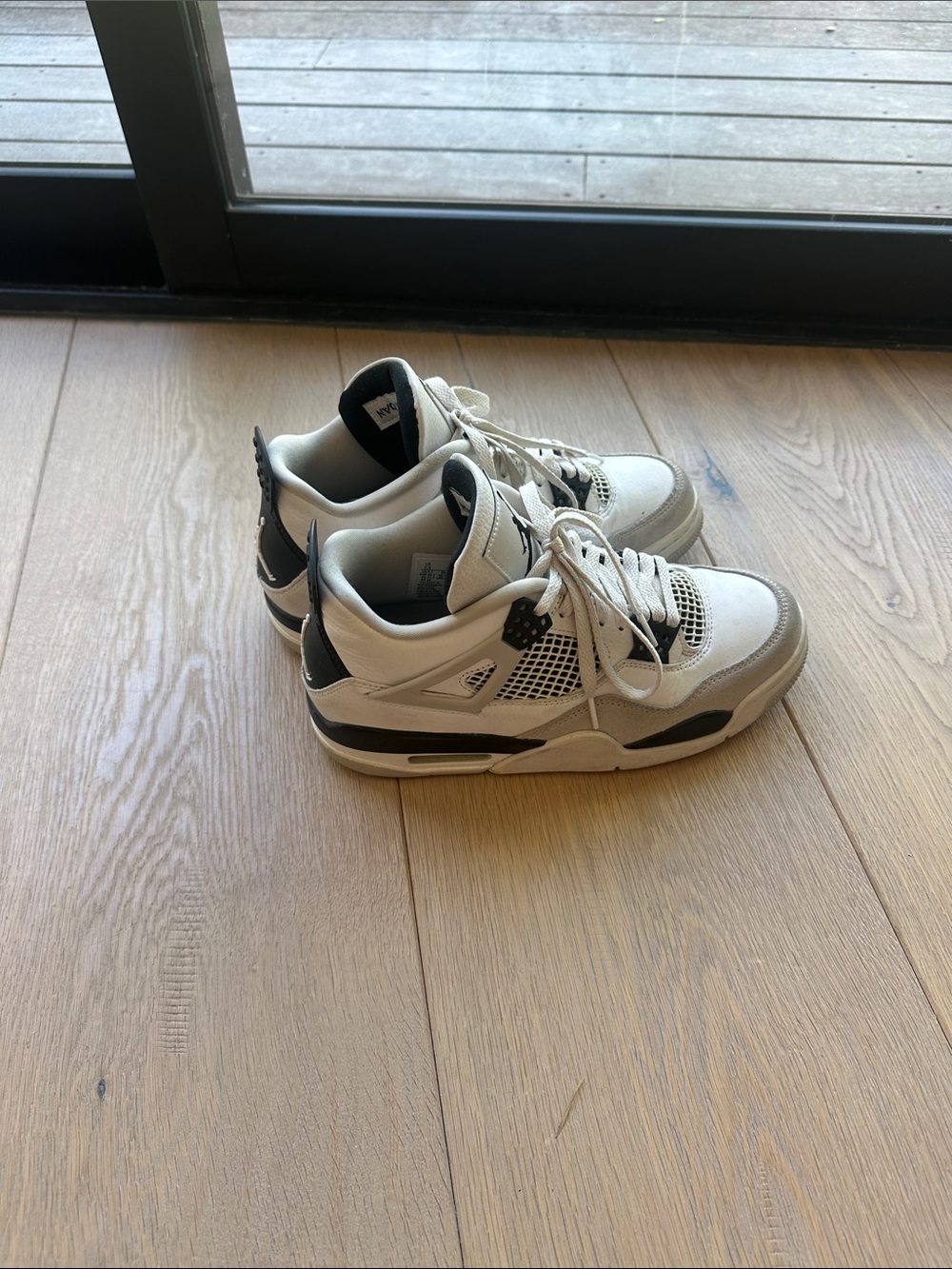 Gray, Black, and white Air Jordan 4s